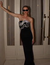 Vestido largo ajustado de alta calidad, color negro, ideal para fiestas de noche o eventos de celebridades en la alfombra roja. Vestido largo sexy sin tirantes con pedrería y vendaje.