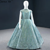 Clear Water Blue Sparkle Flower Girl Dresses Cap Sleeves For Party And Wedding 2025 HTA0051