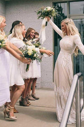 Vestido de novia de tul color marfil, corte línea A, escote barco, mangas largas y apliques WD399