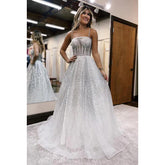 Robe de soirée longue trapèze en tulle à bretelles spaghetti scintillantes et paillettes