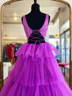 Vestido largo de fiesta de tul morado con volantes y corte en A