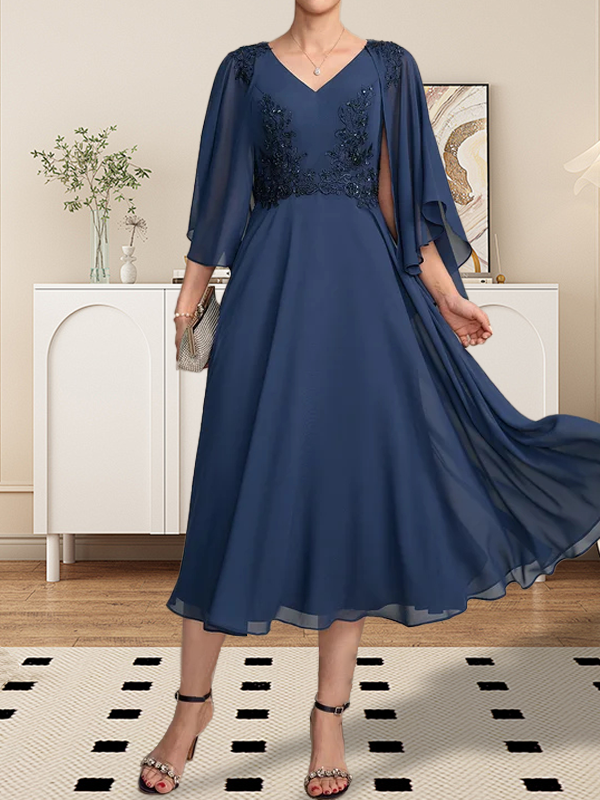 Vestido de corte A, escote en V, largo hasta la rodilla, de gasa, encaje, con lentejuelas y pedrería para la madre de la novia.