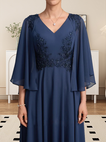 Vestido de corte A, escote en V, largo hasta la rodilla, de gasa, encaje, con lentejuelas y pedrería para la madre de la novia.