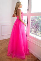 Robe de bal fuchsia deux pièces à fines bretelles et fente sur le devant