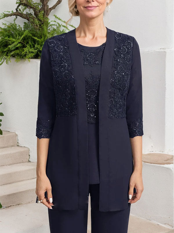 Vestido de novia de gasa con encaje y lentejuelas, estilo mono/traje pantalón, largo hasta el suelo, con escote redondo.