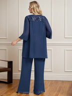 Vestido de novia de gasa con encaje y lentejuelas, estilo mono/pantalón, largo hasta el suelo, con escote redondo.