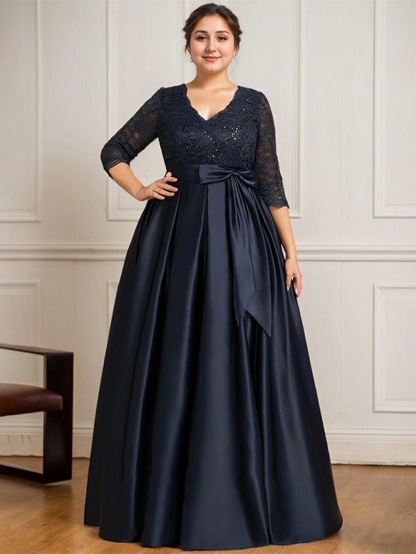 Vestido de novia de satén con encaje, corte en A, escote en V y largo hasta el suelo, con lazo de lentejuelas. 