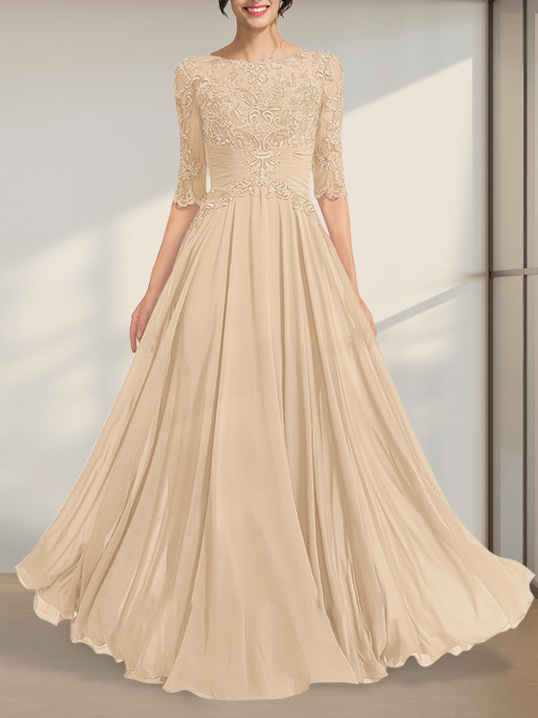 Robe de mère de la mariée en mousseline de soie et dentelle, coupe trapèze, longueur au sol, décolleté illusion, ornée de sequins plissés