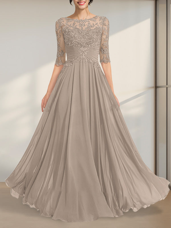 Robe de mère de la mariée en mousseline de soie et dentelle, coupe trapèze, longueur au sol, décolleté illusion, ornée de sequins plissés