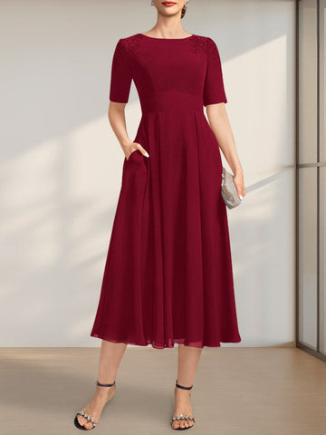 Vestido de corte A, escote redondo, largo té, de gasa, para la madre de la novia, con apliques de encaje y lentejuelas.