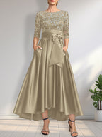 Vestido de madrina de la novia, corte asimétrico, escote ilusión, satén y encaje, con lazo.