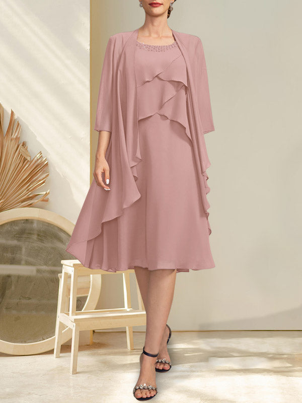 Vestido de gasa corte A con escote redondo y largo hasta la rodilla para la madre de la novia, con pedrería.
