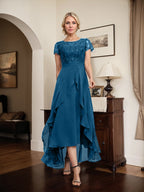 Robe de mère de la mariée asymétrique en mousseline de soie et dentelle, coupe trapèze, décolleté en V, effet illusion, nœud, volants et sequins 