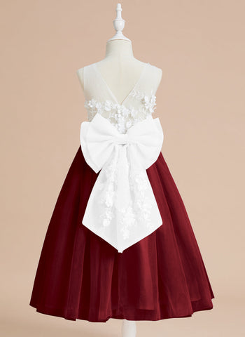 Vestido midi de encaje floral y lazo grande 