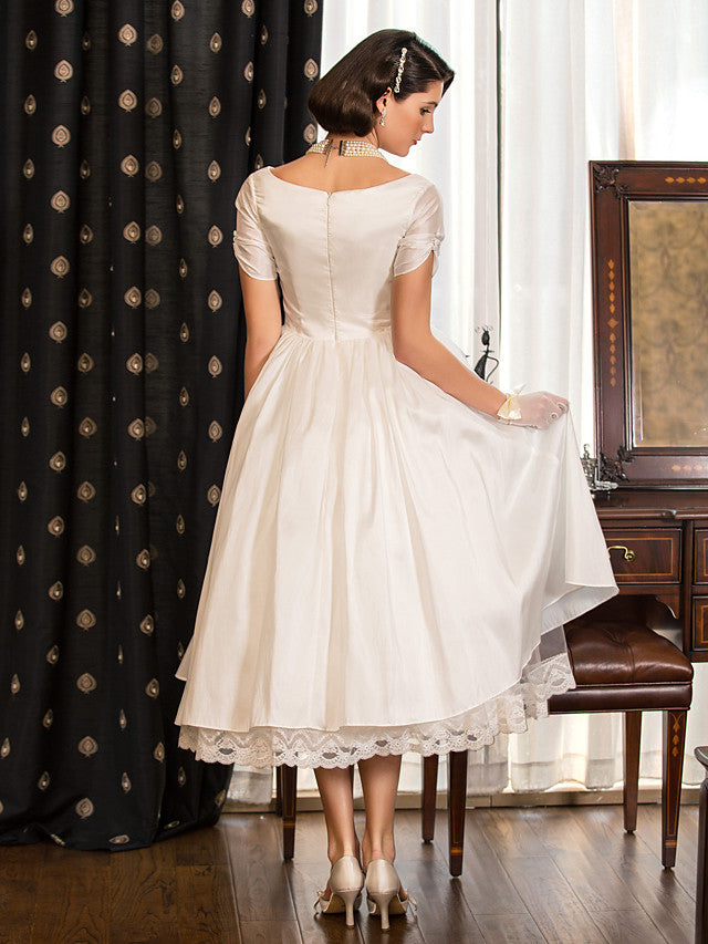 Vestidos de novia cortos estilo vintage de los años 50, corte en A, escote en V y mangas
