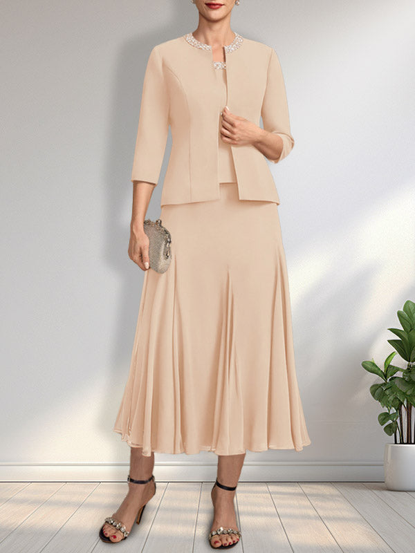 Vestido de novia de gasa, corte línea A, escote redondo, largo té, con lentejuelas y pedrería. 