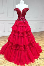 Vestido largo de fiesta rosa claro con escote barco y volantes
