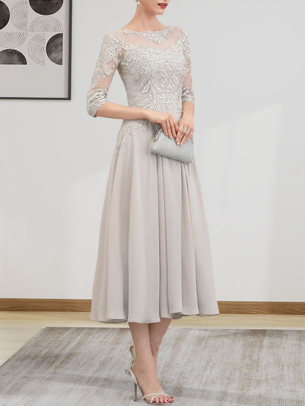 Vestido de novia de corte A, escote redondo ilusión, largo té, de gasa, encaje, con lentejuelas y pedrería.