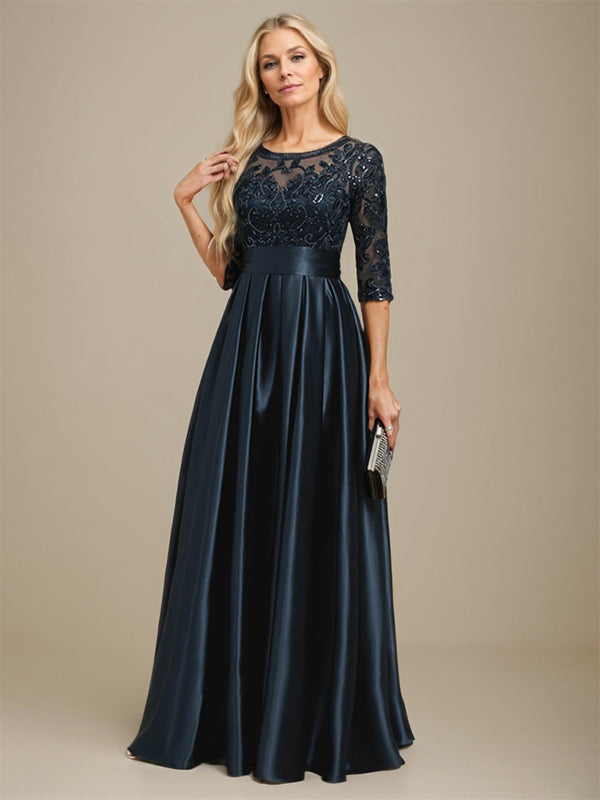 Robe de mariée longue en satin stretch dentelle et dentelle, coupe trapèze, décolleté illusion, ornée d'un nœud à sequins 