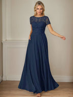 Robe en mousseline de soie bleu marine foncé, coupe trapèze, col bateau et sequins 