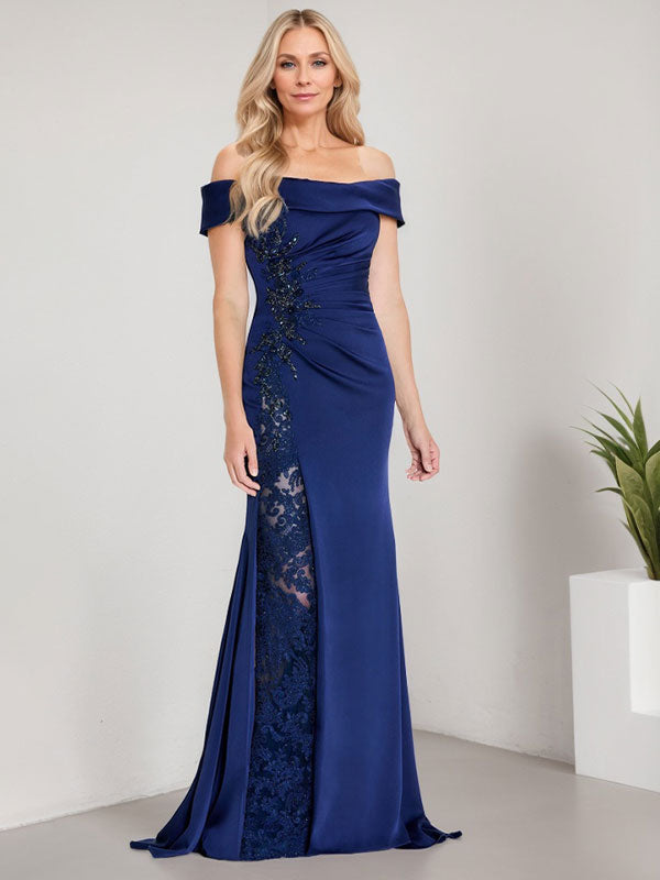 Vestido de corte sirena para la madre de la novia, largo hasta el suelo, con hombros descubiertos, apliques y pedrería, con abertura alta. 