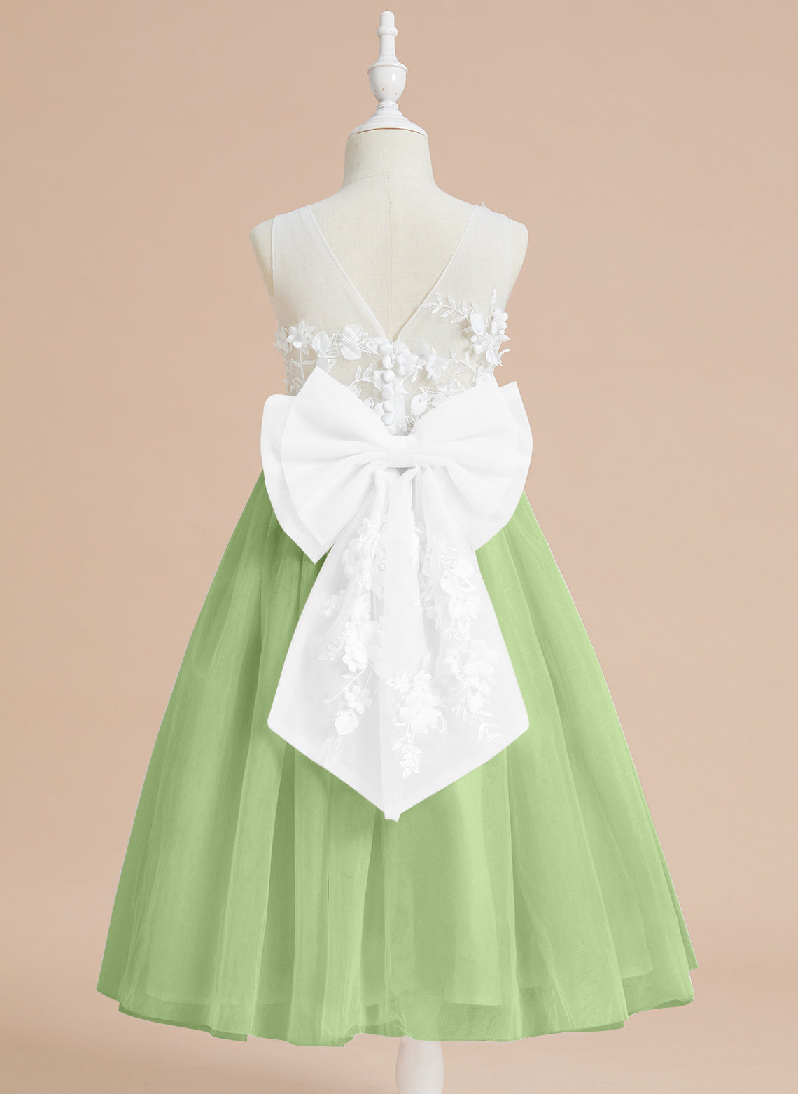 Vestido midi de encaje floral y lazo grande 