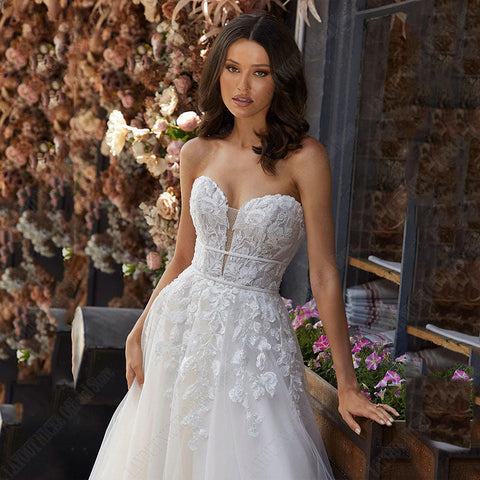 Vestido de novia corte A, manga larga desmontable, elegante, espalda descubierta, encaje, apliques de tul. 