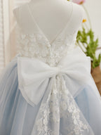Vestido midi de encaje floral y lazo grande 