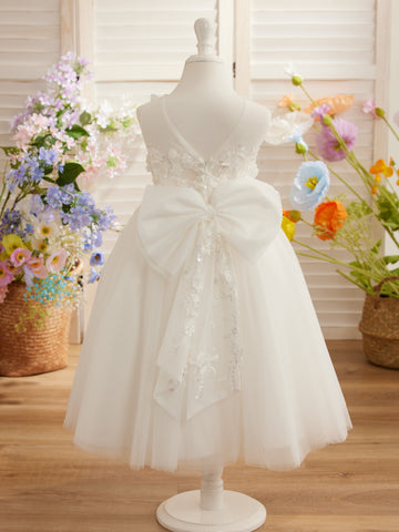 Vestido midi de encaje floral y lazo grande 