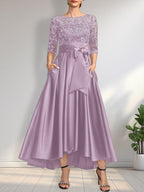 Vestido de madrina de la novia, corte asimétrico, escote ilusión, satén y encaje, con lazo.