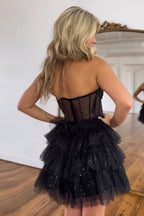 Robe de bal bustier en tulle à volants et corset à sequins