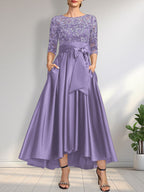 Vestido de madrina de la novia, corte asimétrico, escote ilusión, satén y encaje, con lazo.