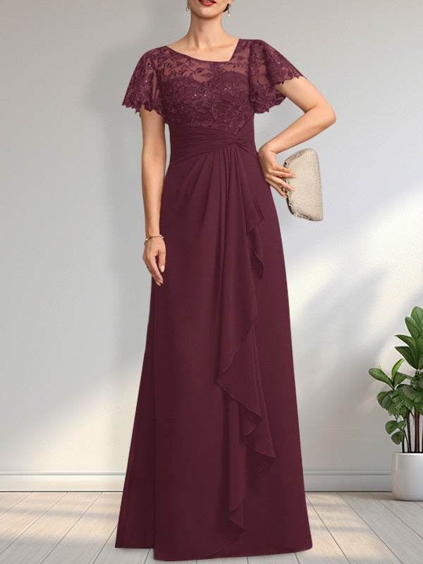 Vestido de novia de corte asimétrico, ilusión, largo hasta el suelo, de encaje y gasa, con cascada de volantes y lentejuelas. 