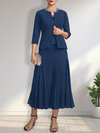 Vestido de novia de gasa, corte línea A, escote redondo, largo té, con lentejuelas y pedrería. 