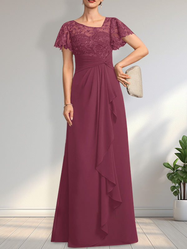 Vestido de novia de corte asimétrico, ilusión, largo hasta el suelo, de encaje y gasa, con cascada de volantes y lentejuelas. 