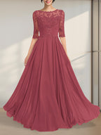 Robe de mère de la mariée en mousseline de soie et dentelle, coupe trapèze, longueur au sol, décolleté illusion, ornée de sequins plissés