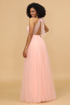 Vestido largo de dama de honor rosa con escote halter y corte en A
