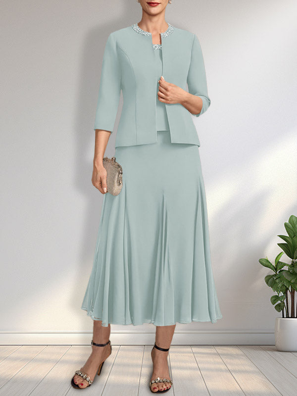 Vestido de novia de gasa, corte línea A, escote redondo, largo té, con lentejuelas y pedrería. 