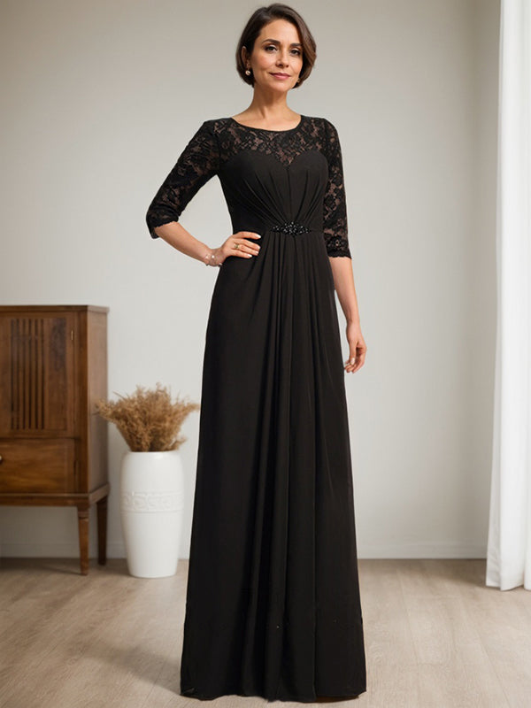 Vestido de novia de corte línea A, escote redondo ilusión, largo hasta el suelo, de gasa de encaje con volantes y pedrería. 