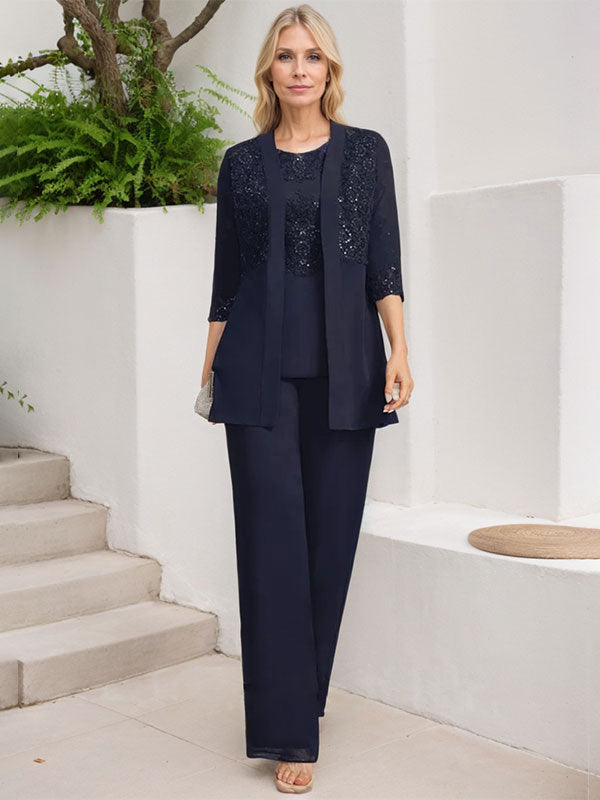 Vestido de novia de gasa con encaje y lentejuelas, estilo mono/traje pantalón, largo hasta el suelo, con escote redondo.