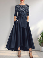 Vestido de madrina de la novia, corte asimétrico, escote ilusión, satén y encaje, con lazo.