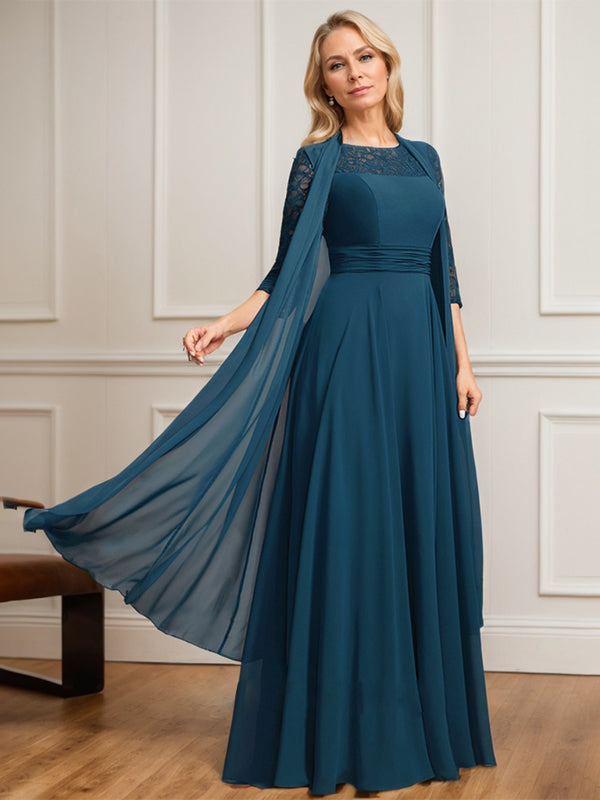 Robe de mère de la mariée en mousseline de dentelle, coupe trapèze, décolleté plongeant illusion, longueur au sol, avec plis. 