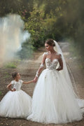 Elegantes vestidos de novia largos hasta el suelo de tul y encaje con mangas