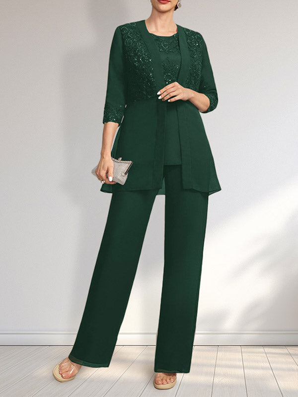 Vestido de novia de gasa con encaje y lentejuelas, estilo mono/traje pantalón, largo hasta el suelo, con escote redondo.