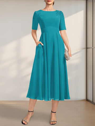 Vestido de corte A, escote redondo, largo té, de gasa, para la madre de la novia, con apliques de encaje y lentejuelas.