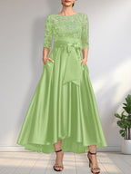 Vestido de madrina de la novia, corte asimétrico, escote ilusión, satén y encaje, con lazo.