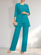 Vestido de novia de gasa con encaje y lentejuelas, estilo mono/traje pantalón, largo hasta el suelo, con escote redondo.