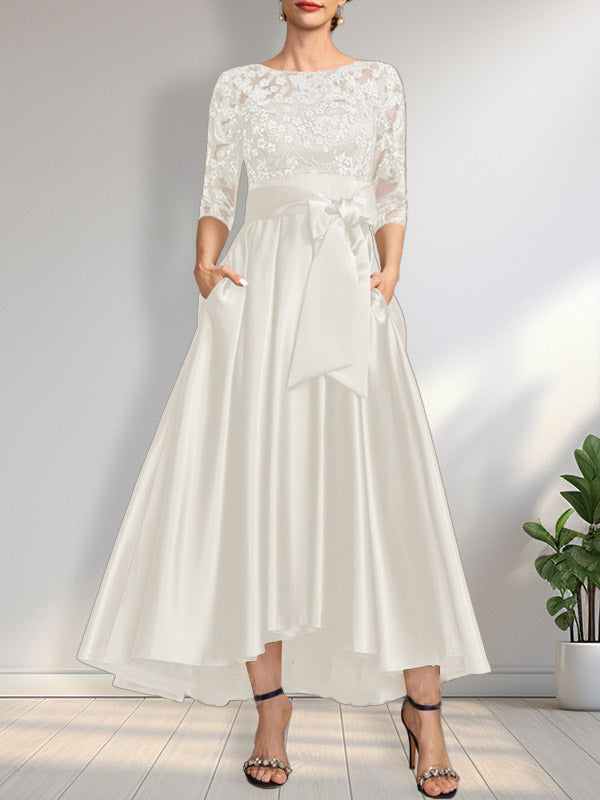 Vestido de madrina de la novia, corte asimétrico, escote ilusión, satén y encaje, con lazo.