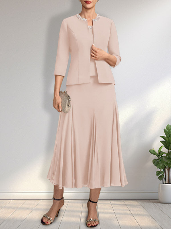 Vestido de novia de gasa, corte línea A, escote redondo, largo té, con lentejuelas y pedrería. 