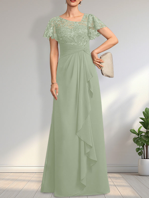 Vestido de novia de corte asimétrico, ilusión, largo hasta el suelo, de encaje y gasa, con cascada de volantes y lentejuelas. 